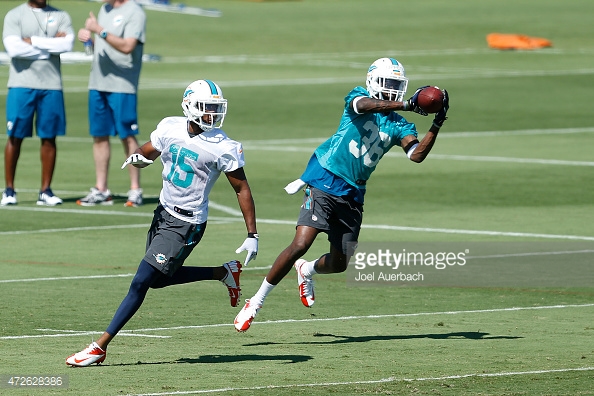 DAVIE, FL - MAY 8: Tony Lippett #36 intercepts the ball intended for Tyler McDonald #15 of the Miami Dolphins during the rookie minicamp on May 8, 2015 at the Miami Dolphins training facility in Davie, Florida. (Photo by Joel Auerbach/Getty Images) *** Local Caption *** Tyler McDonald;Tony Lippett